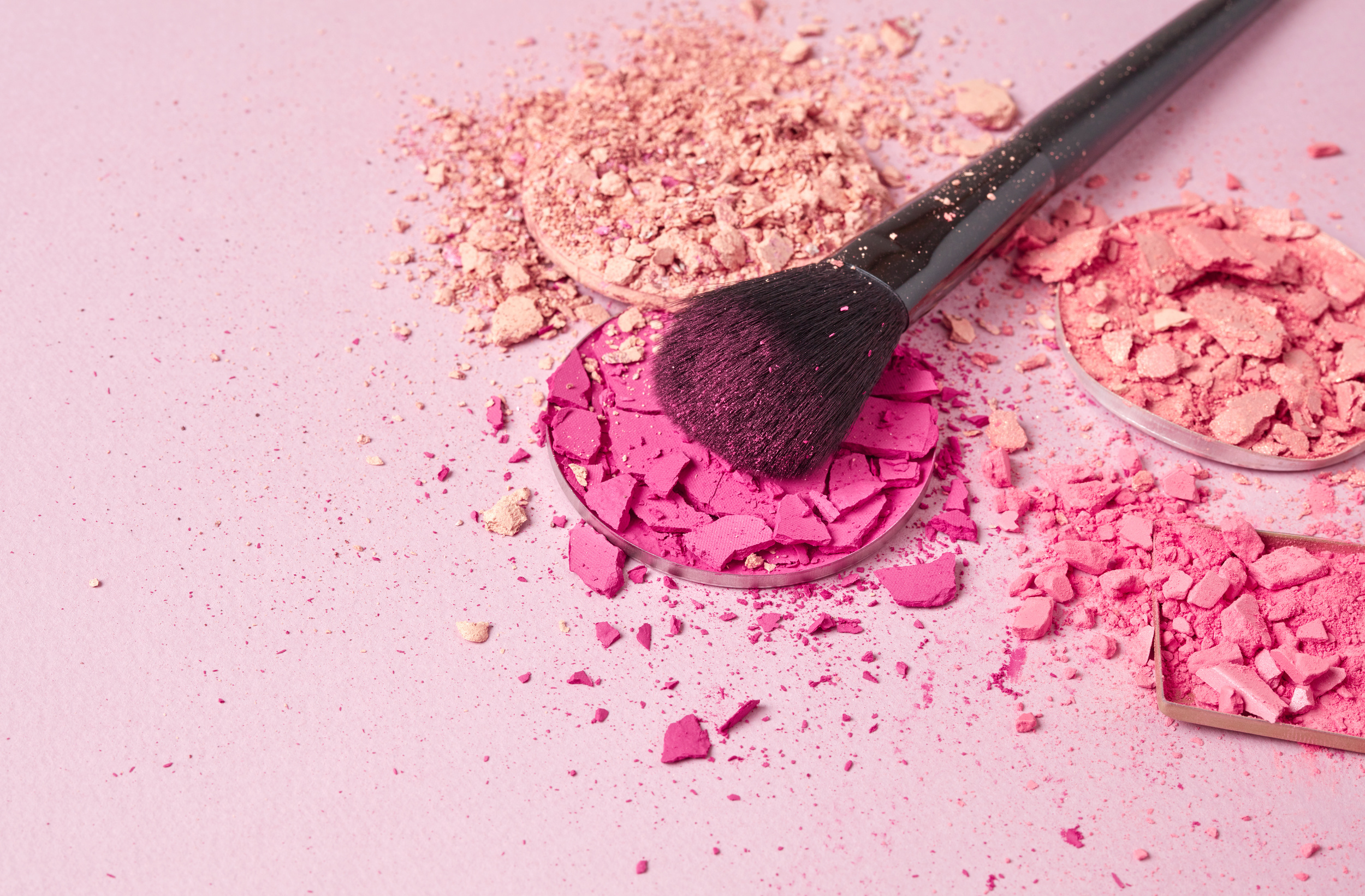 Make up brush with brush stroke  of colored make up powder